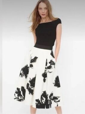 Ivory midi skirt with a black line print from the White House Black Market brand